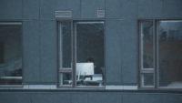 person working on computer near a window