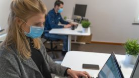 employees in office wearing masks