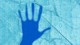 Hand in front of binary code