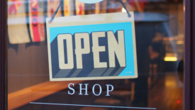 Shop door with open sign displayed